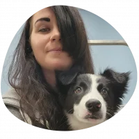 A picture of Kelly with a black and white dog