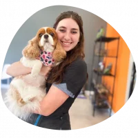 A picture of Rylie holding a dog